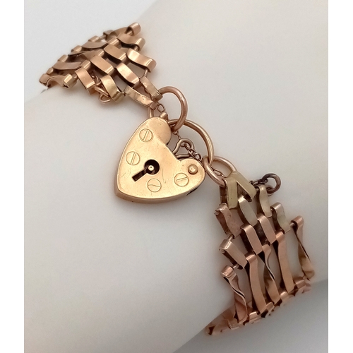 13 - A 9K Yellow Gold Gate Bracelet with Heart Clasp and Safety Chain. 18cm. 12g.