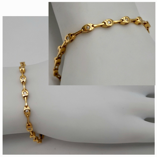 27 - A Stylish 18K Yellow Gold Diamond Tennis Bracelet. 16cm. 10g