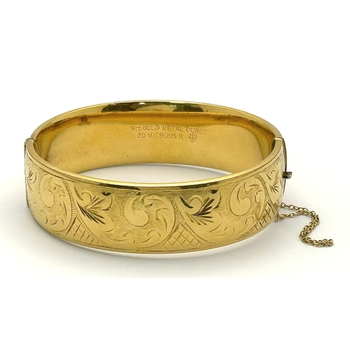 429 - A Vintage 9K Gold Plated (20 microns) Bangle. Decorative band with clip open design. 40g.
