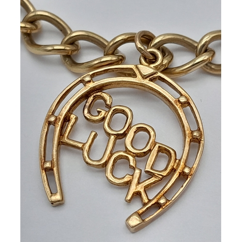 693 - A 9K GOLD CHARM BRACELET WITH 7 CHARMS TO INCLUDE A GOOD LUCK HORSESHOE,THE EIFFEL TOWER , A NICE CU... 
