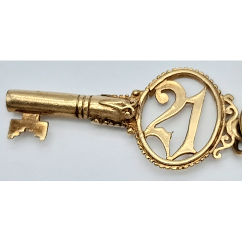 693 - A 9K GOLD CHARM BRACELET WITH 7 CHARMS TO INCLUDE A GOOD LUCK HORSESHOE,THE EIFFEL TOWER , A NICE CU... 