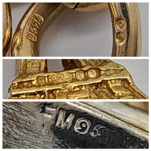 693 - A 9K GOLD CHARM BRACELET WITH 7 CHARMS TO INCLUDE A GOOD LUCK HORSESHOE,THE EIFFEL TOWER , A NICE CU... 
