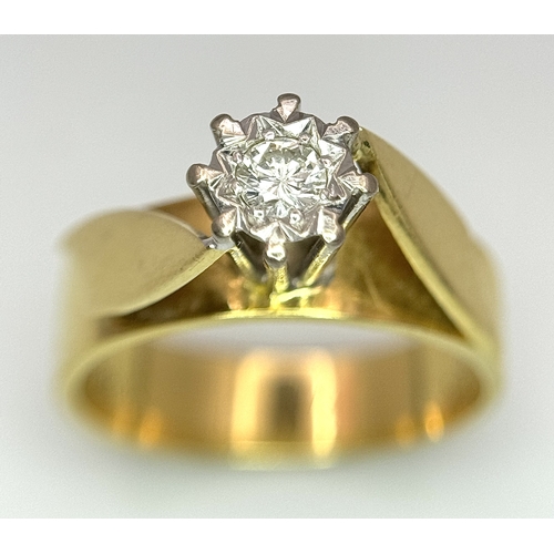 777 - An 18K Yellow Gold Diamond Solitaire Ring. A brilliant round cut diamond in a raised setting. Size K... 