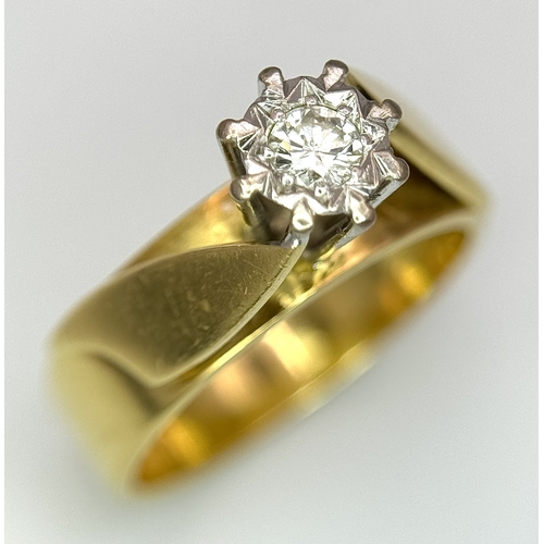 777 - An 18K Yellow Gold Diamond Solitaire Ring. A brilliant round cut diamond in a raised setting. Size K... 