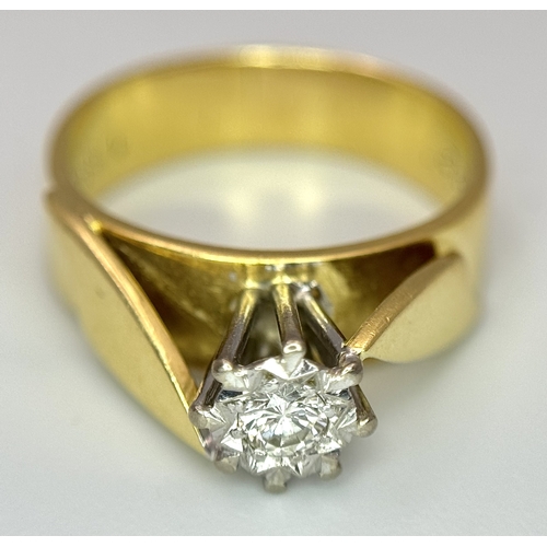 777 - An 18K Yellow Gold Diamond Solitaire Ring. A brilliant round cut diamond in a raised setting. Size K... 