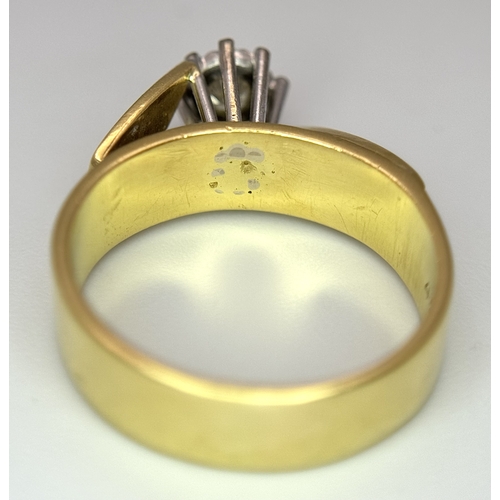 777 - An 18K Yellow Gold Diamond Solitaire Ring. A brilliant round cut diamond in a raised setting. Size K... 