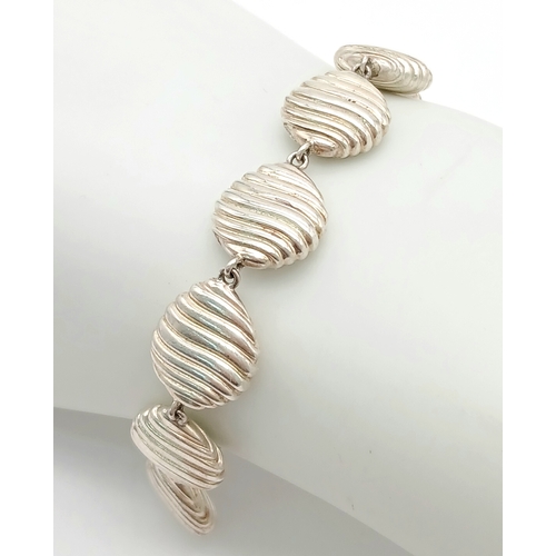 874 - A 925 Silver Bracelet - Shell Form Links. 16cm. 25g