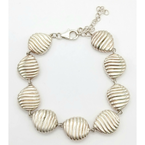 874 - A 925 Silver Bracelet - Shell Form Links. 16cm. 25g