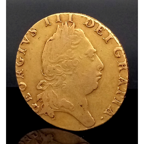 32 - A 1798 GEORGE III GUINEA COIN. FIFTH HEAD. 22K GOLD.  8.3G. F+, BUT PLEASE SEE PHOTOS. C-5022