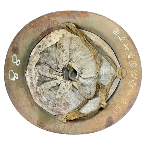 54 - A WW2 Japanese Type 90 Home Guard Leaders Helmet with liner and chin strap. Named to the 7th Guard C... 