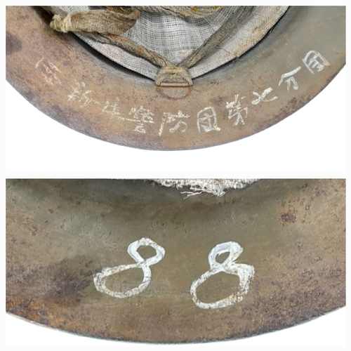 54 - A WW2 Japanese Type 90 Home Guard Leaders Helmet with liner and chin strap. Named to the 7th Guard C... 