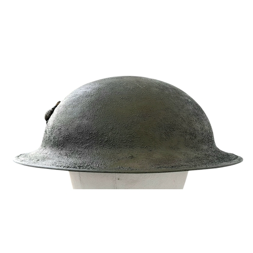 194 - A WW1 US Brodie Helmet, no liner with a USMC Badge adhered to the front. Nice straight WW1 Helmet wi... 