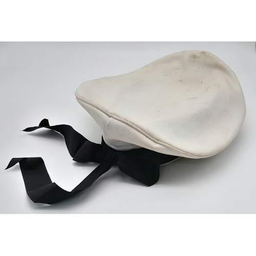 811 - A WW2 Re-enactors Kriegsmarine White Top “Donald Duck” Hat. Original Cap Badge and Tally on a post W... 
