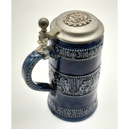 817 - A WW1/WW1 German Naval Wound Badge on top of a Pewter Lidded Stein.