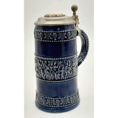817 - A WW1/WW1 German Naval Wound Badge on top of a Pewter Lidded Stein.