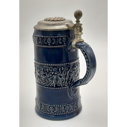 817 - A WW1/WW1 German Naval Wound Badge on top of a Pewter Lidded Stein.