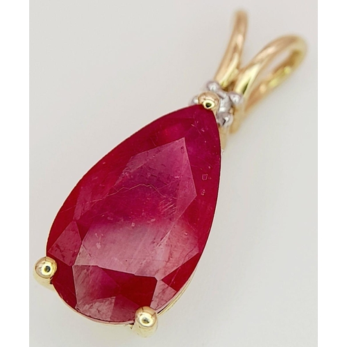 736 - A 10K YELLOW GOLD DIAMOND & PEAR SHAPED GLASS FILLED RUBY PENDANT. RUBY APPROX 4CT. 2.3G. 2CM. JB710... 