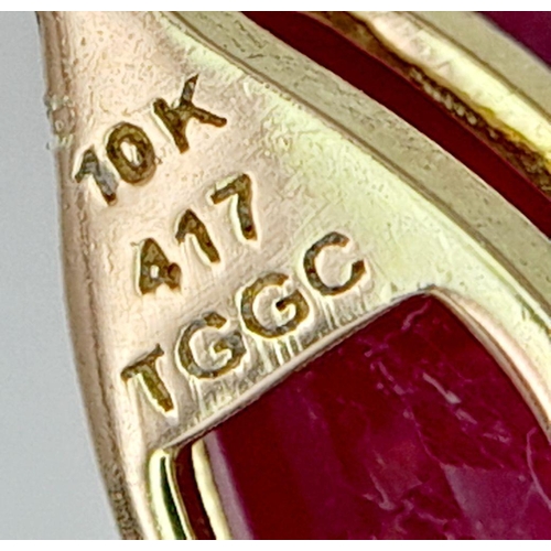 736 - A 10K YELLOW GOLD DIAMOND & PEAR SHAPED GLASS FILLED RUBY PENDANT. RUBY APPROX 4CT. 2.3G. 2CM. JB710... 