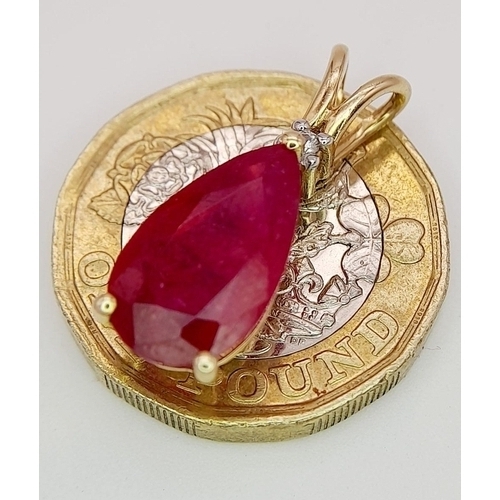 736 - A 10K YELLOW GOLD DIAMOND & PEAR SHAPED GLASS FILLED RUBY PENDANT. RUBY APPROX 4CT. 2.3G. 2CM. JB710... 