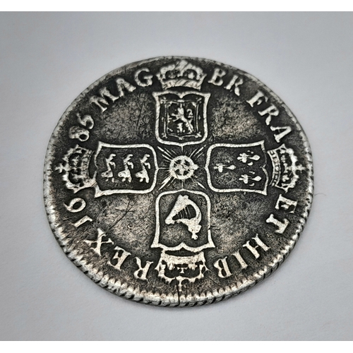 57 - A 1685 JAMES II SHILLING COIN 5.5G TOTAL WEIGHT. REF: TAN 5006