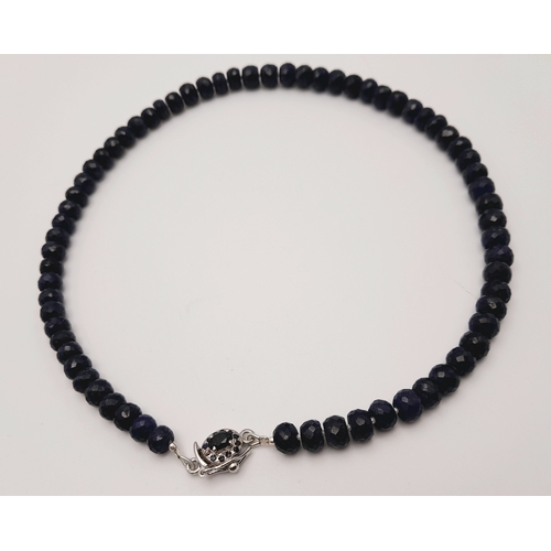 716 - A Faceted Blue Sapphire Graduated Rondelle Necklace with Sapphire Clasp, set in silver. 44cm. Cd-171... 