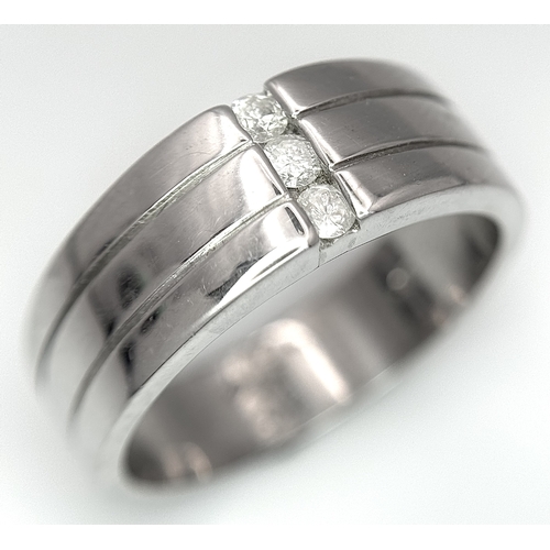401 - A 9k white gold diamond band ring - 0.15ctw diamonds. 8.2g total weight. Size S. 2327H.