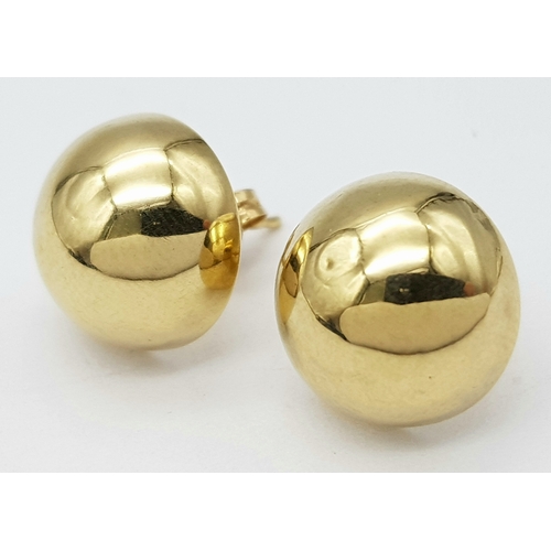 744 - A pair of 9k yellow gold half ball stud earrings. 1.2g total weight. 9035H
