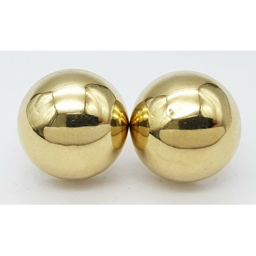 744 - A pair of 9k yellow gold half ball stud earrings. 1.2g total weight. 9035H