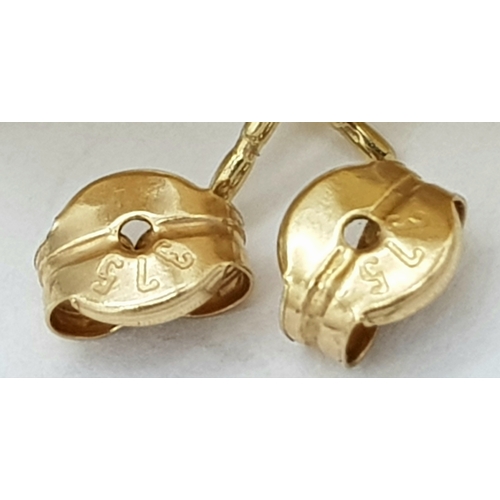 744 - A pair of 9k yellow gold half ball stud earrings. 1.2g total weight. 9035H