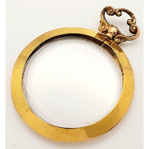 686 - An Antique 9K Gold Glass Locket Pendant. Hallmarks for Birmingham 1914. 5.4g total weight.
