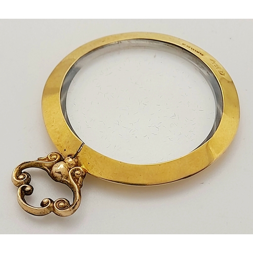 686 - An Antique 9K Gold Glass Locket Pendant. Hallmarks for Birmingham 1914. 5.4g total weight.