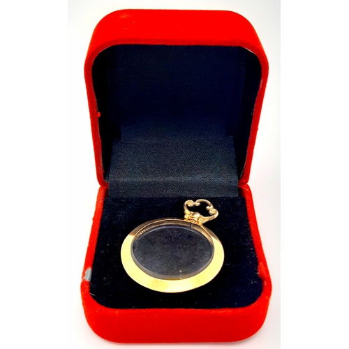 686 - An Antique 9K Gold Glass Locket Pendant. Hallmarks for Birmingham 1914. 5.4g total weight.