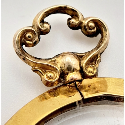 686 - An Antique 9K Gold Glass Locket Pendant. Hallmarks for Birmingham 1914. 5.4g total weight.