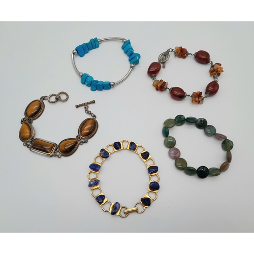 764 - Five Different Style Semi-Precious Gemstone Bracelets. Includes lapis and Tigers Eye.