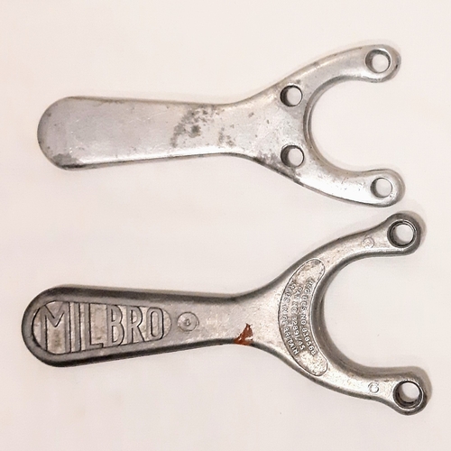 772 - Two vintage, 1950's aluminium slingshots. Including one Milbro.