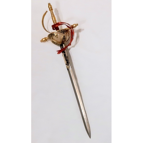779 - A miniature Toledo sword letter opener. Length: 25cm