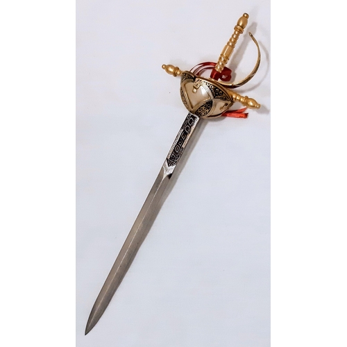 779 - A miniature Toledo sword letter opener. Length: 25cm