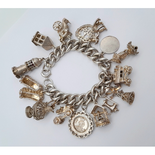 869 - A Vintage Sterling Silver Charm Bracelet - Includes, Carriage, 
stagecoach and lighthouse! Good cond... 