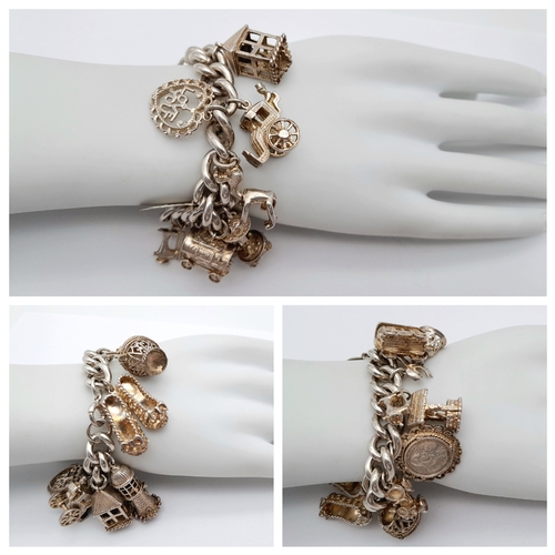 869 - A Vintage Sterling Silver Charm Bracelet - Includes, Carriage, 
stagecoach and lighthouse! Good cond... 