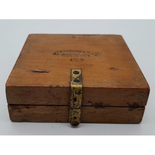 876 - A WWI Soldiers Marching Compass. Fully working in wooden case. Makers mark of J. Wardale and Co. 8cm... 
