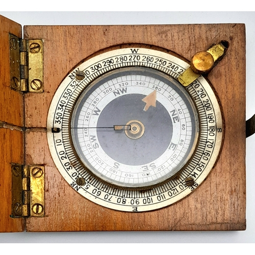 876 - A WWI Soldiers Marching Compass. Fully working in wooden case. Makers mark of J. Wardale and Co. 8cm... 