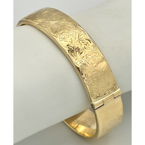 1212 - A Vintage 9K Yellow Gold Bangle. 14mm width. Chester hallmarks. A few dents and minor discolouration... 
