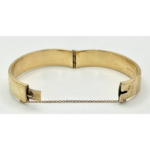 1212 - A Vintage 9K Yellow Gold Bangle. 14mm width. Chester hallmarks. A few dents and minor discolouration... 