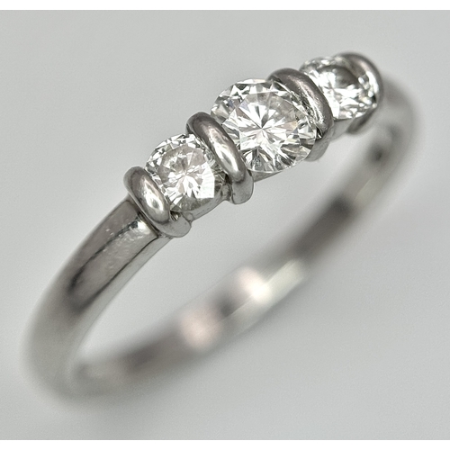 191 - A PLATINUM DIAMOND 3 STONE RING - 0.56CT CENTRE DIAMOND IS GIA CERTIFIED -0.26CT. H - COLOUR. VS1 CL... 