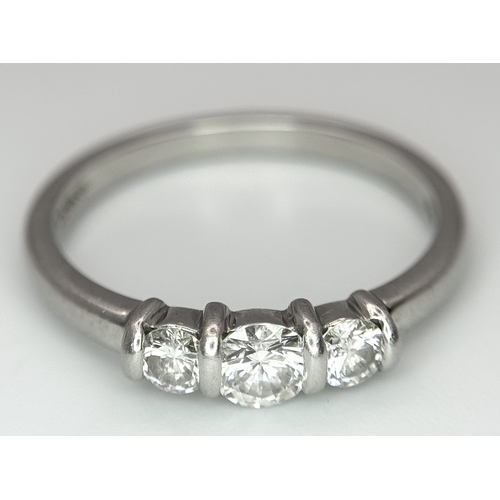 191 - A PLATINUM DIAMOND 3 STONE RING - 0.56CT CENTRE DIAMOND IS GIA CERTIFIED -0.26CT. H - COLOUR. VS1 CL... 
