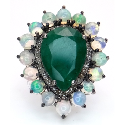 233 - A 6Ct Pear Cut Emerald Ring with a 0.20ctw Diamond and 2ctw of Opal surround. Size O. With case. Cd-... 