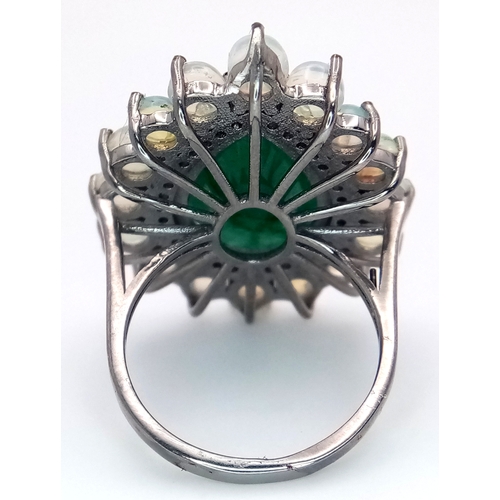 233 - A 6Ct Pear Cut Emerald Ring with a 0.20ctw Diamond and 2ctw of Opal surround. Size O. With case. Cd-... 