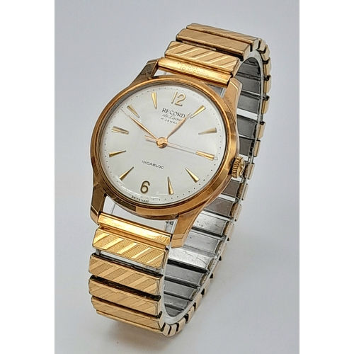 192 - A Vintage 9K Gold Cased Record Mechanical Gents Watch. Expandable bracelet. 9k gold case - 34mm. Sil... 
