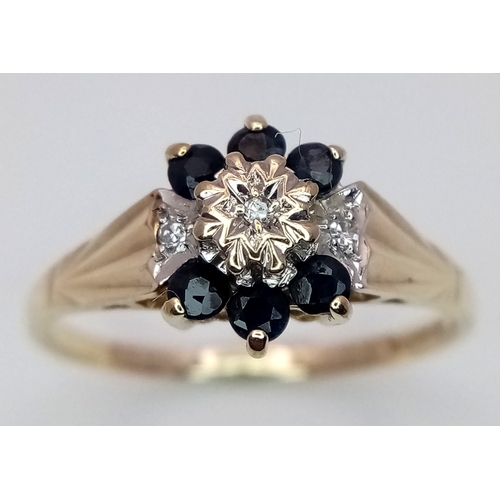 204 - A 9K YELLOW GOLD  DIAMOND AND SAPPHIRE RING. 1.9G. SIZE N. SC7075.