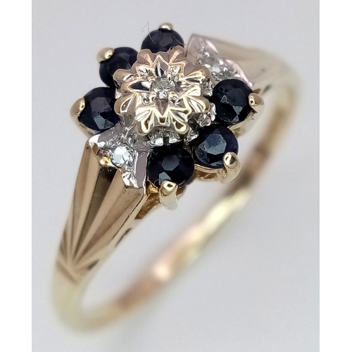 204 - A 9K YELLOW GOLD  DIAMOND AND SAPPHIRE RING. 1.9G. SIZE N. SC7075.